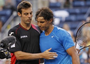 Marcel Granollers of Spain and compatriot Rafael Nadal embrace at the net after Nadal defeated Granollers in their match at the Indian Wells ATP tennis tournament in Indian Wells, California