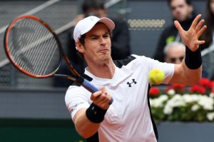 Britain tennis player Andy Murray returns a ball to Spanish tennis player Rafael Nadal during the men semifinal of Madrid Open tournament at the Caja Magica (Magic Box) sports complex in Madrid on May 7, 2016. / AFP PHOTO / GERARD JULIEN