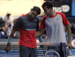 Rafael Nadal of Spain, right, talks with Grigor Dimitrov of Bulgaria at the net after Nadal won their quarterfinal at the Australian Open tennis championship in Melbourne, Australia, Wednesday, Jan. 22, 2014.(AP Photo/Andrew Brownbill)